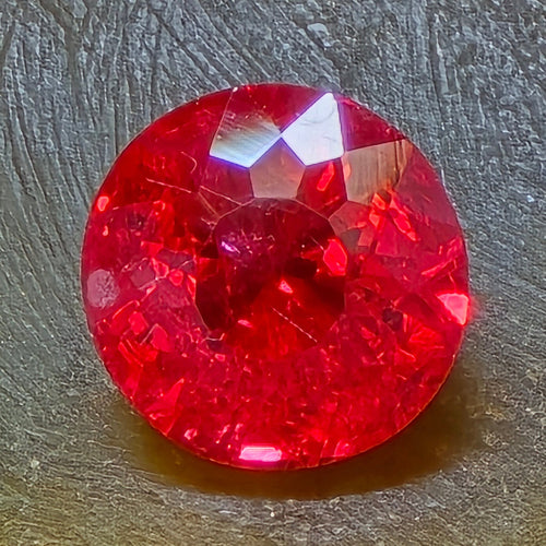 0.87 Carat Round Neon Orangey Red Spinel from Mahenge Tanzania